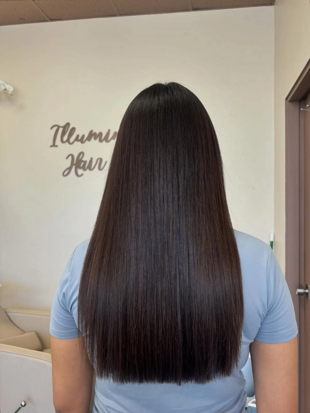 Very long straight dark hair with blunt lower edge