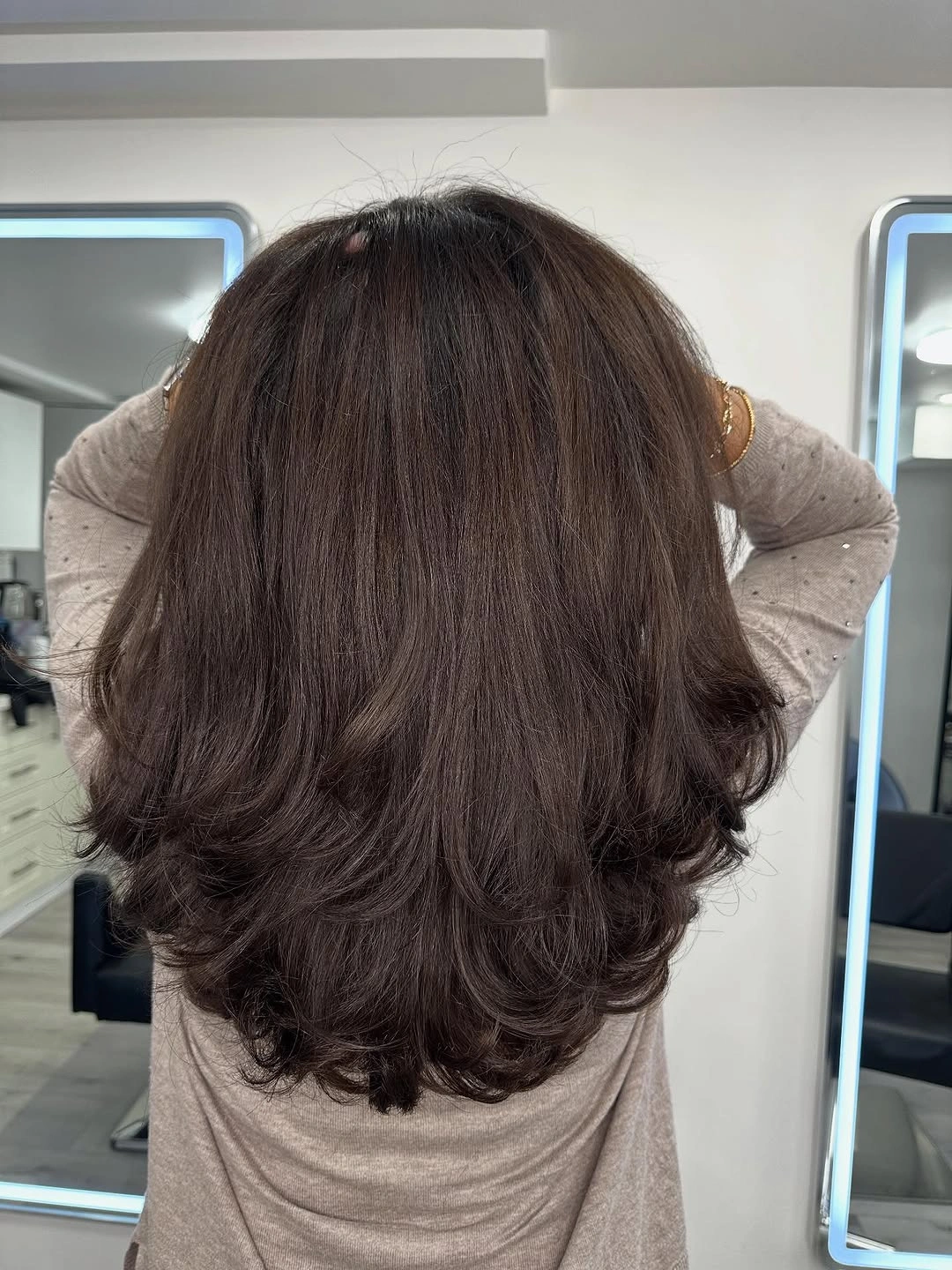 Long dark hair with full waves and rounded ends
