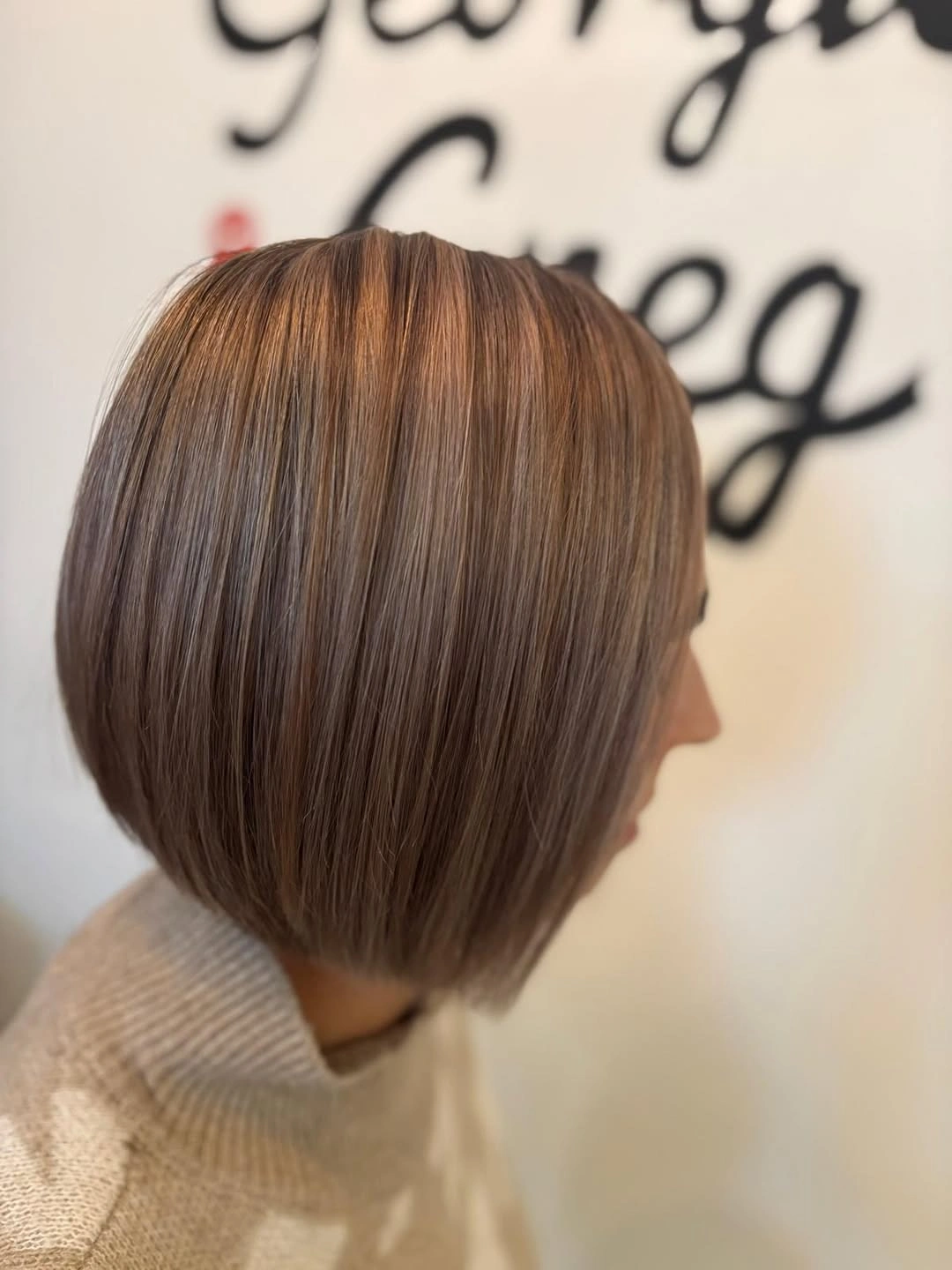 Short smooth brown bob with rounded beveled edge