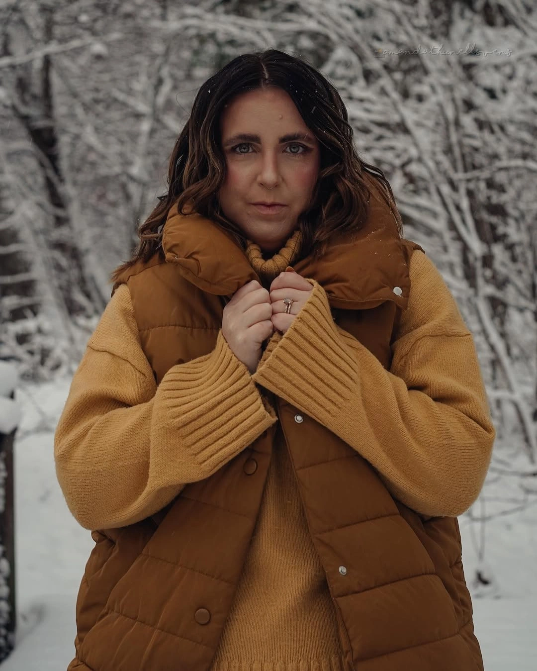 Close crop of golden vest and mustard ribbed sweater