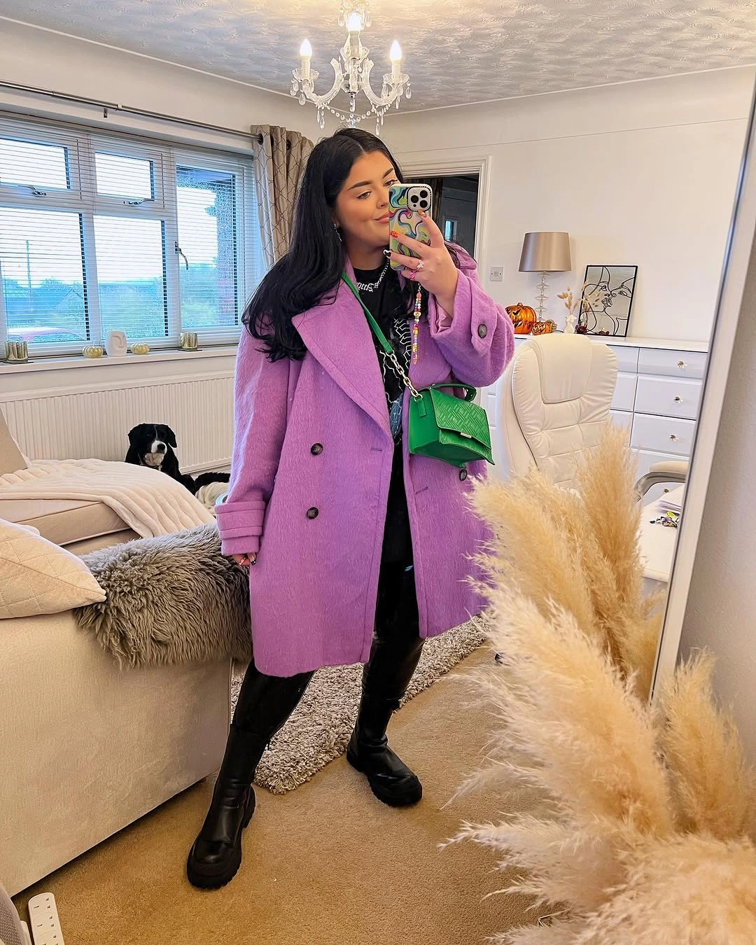 Lilac-purple coat, black outfit, green mini bag and boots