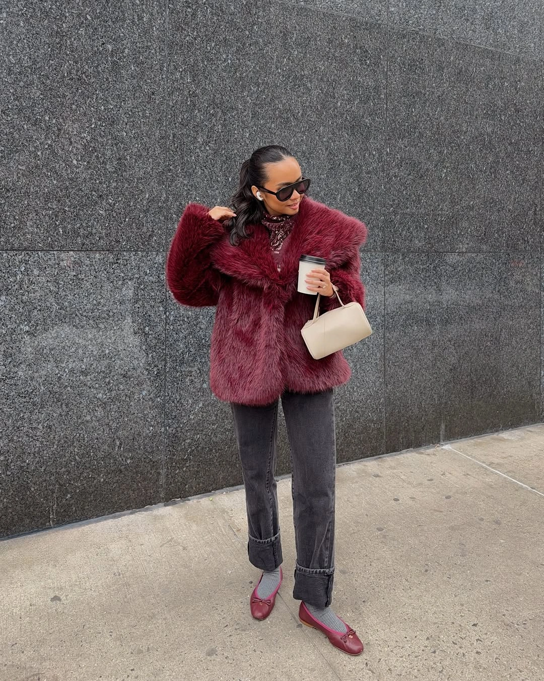 Burgundy fur-like jacket with cuffed jeans and red flats