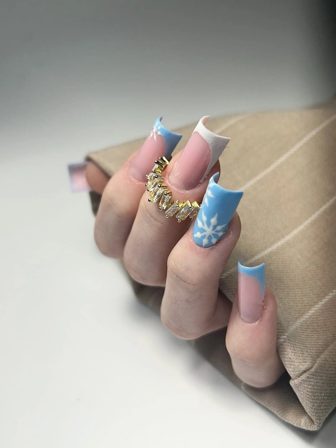 Long squared blue and white French nails with snowflake