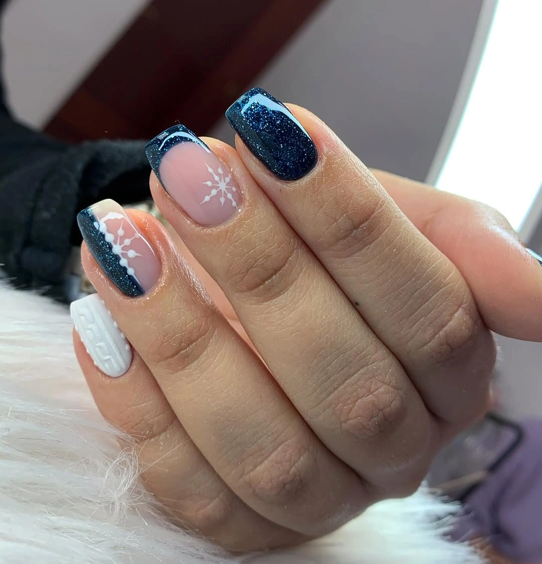 Short square nails with navy glitter tips and cable texture