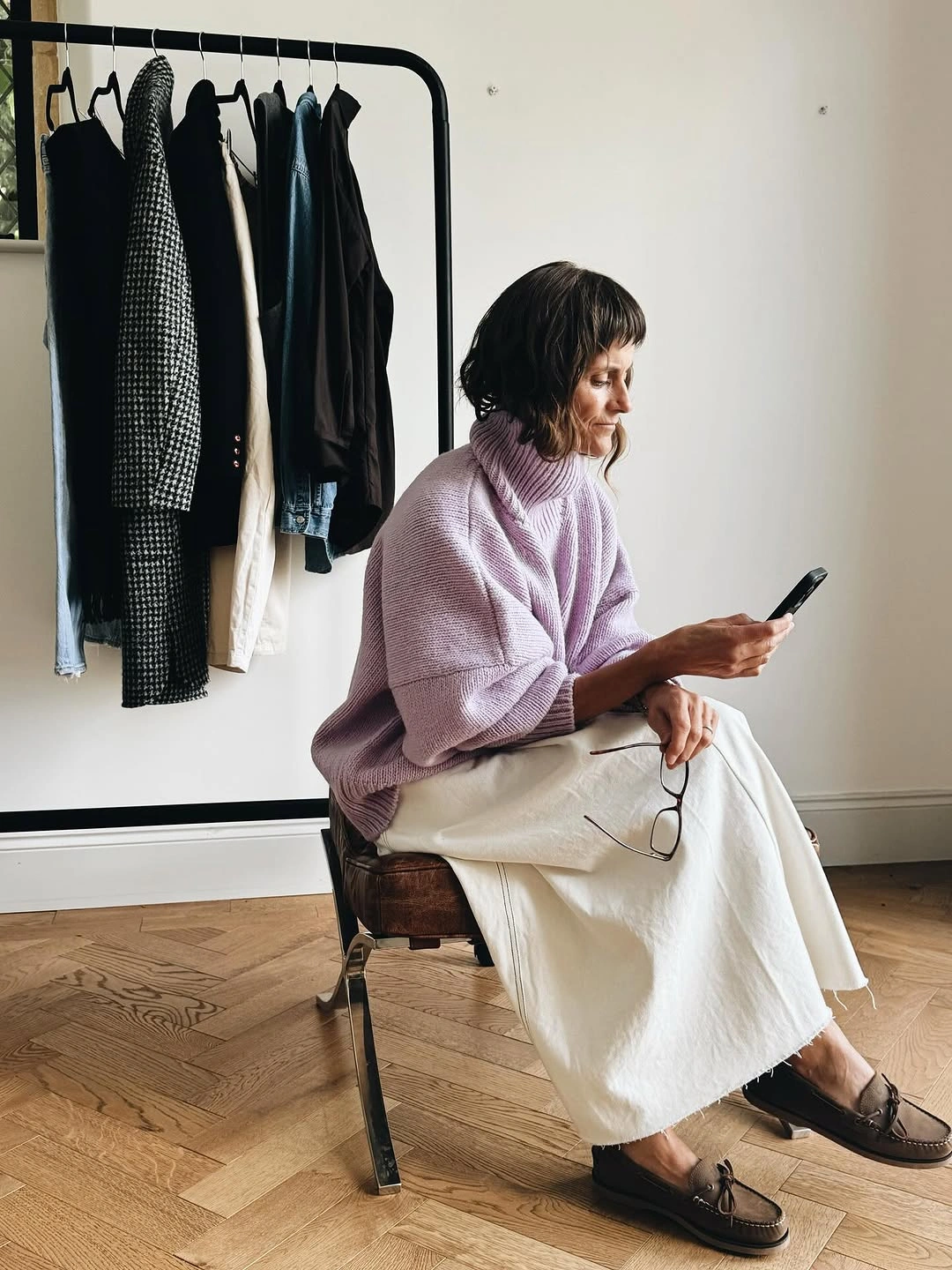Lavender oversized sweater with pale long skirt and dark loafers