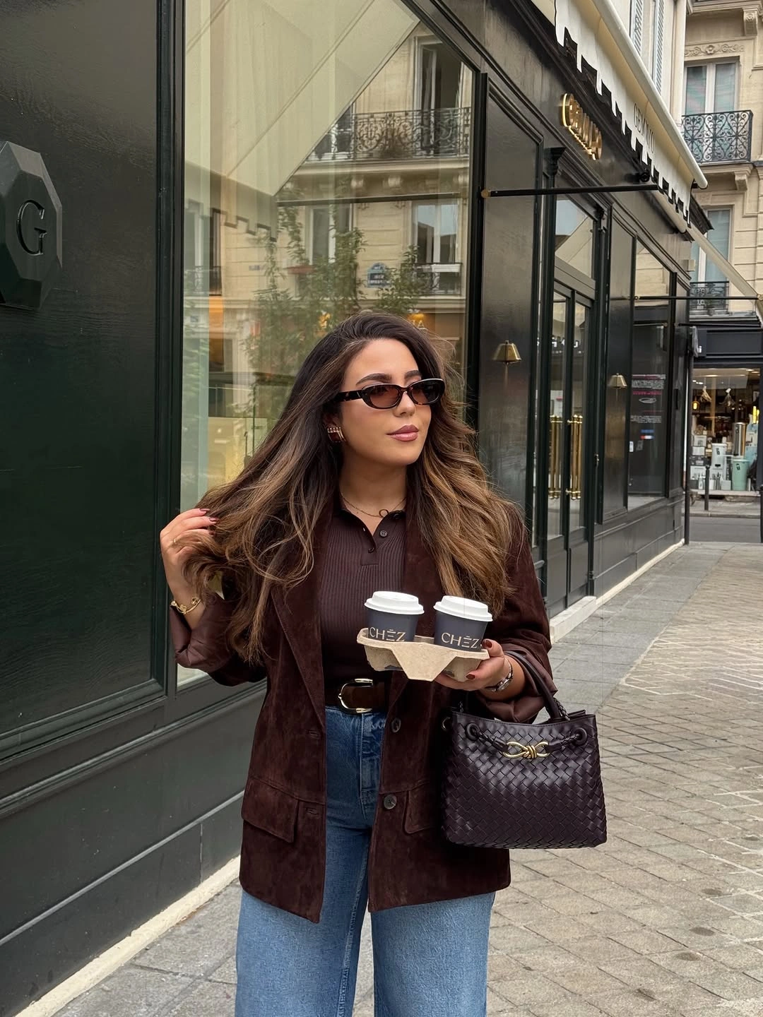 Dark burgundy jacket and collared top with loose blue jeans