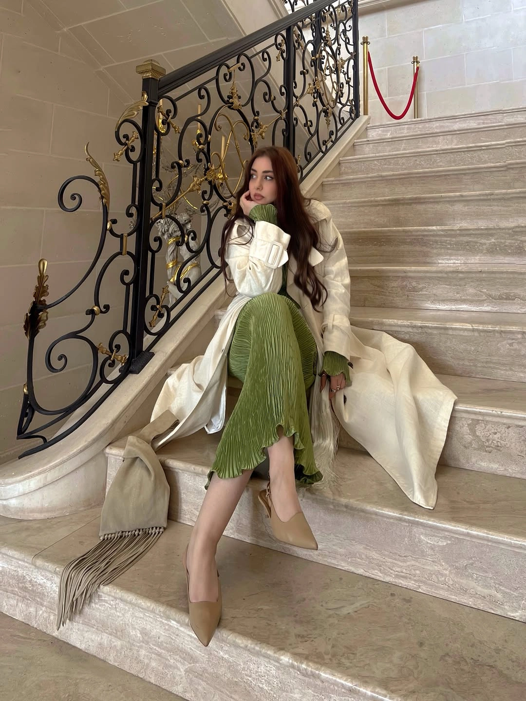 Long ivory coat over green pleated lower layer with beige heels