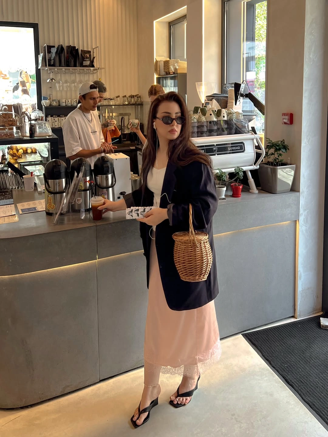 Pale peach long dress with navy blazer woven handbag and black sandals