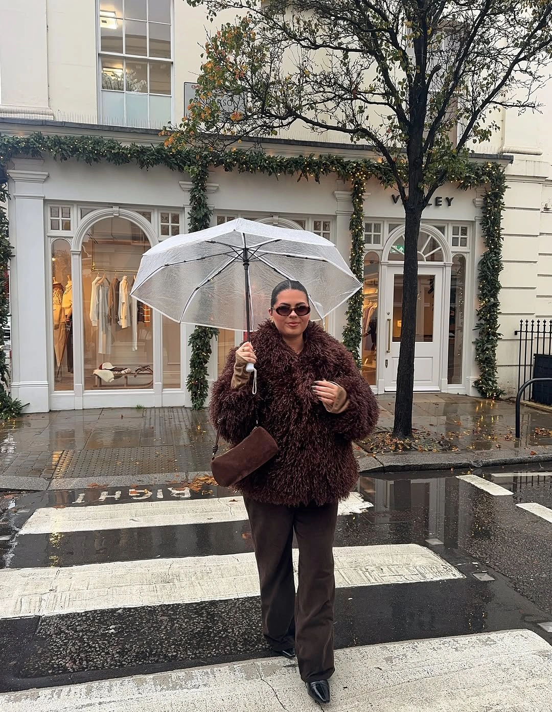 Burgundy shaggy jacket with dark trousers and pointed shoes