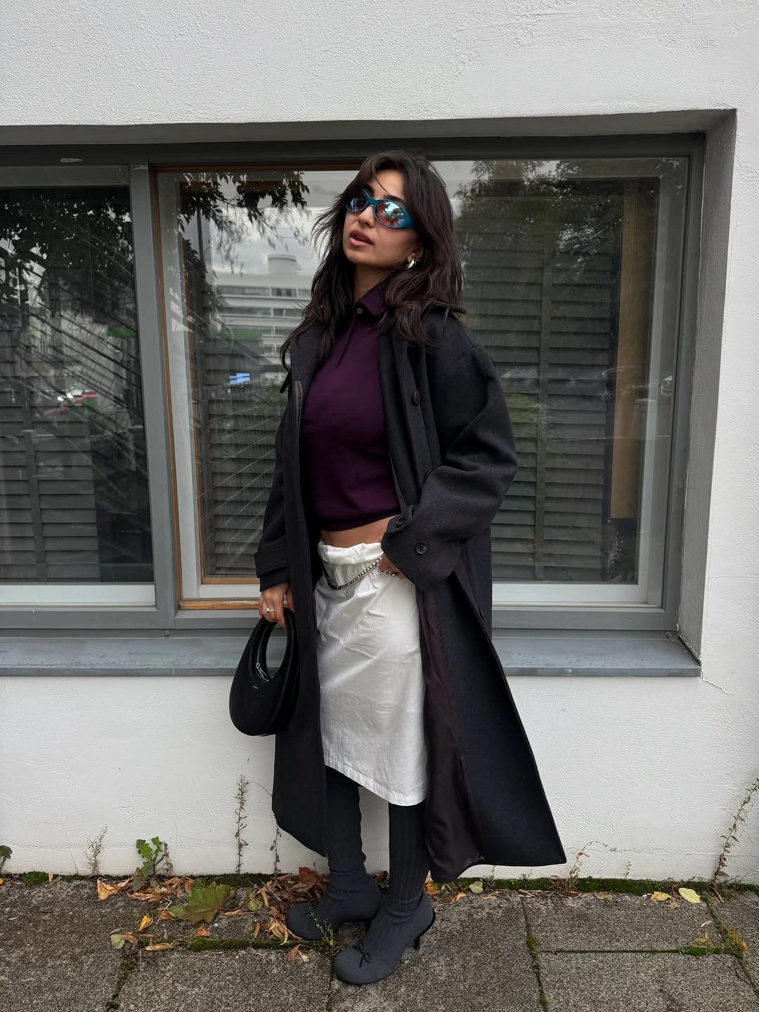Long black coat with plum top and pale wrap-like hip layer