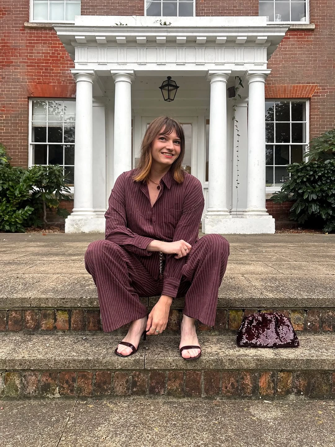 Burgundy striped shirt and trousers with dark heeled sandals