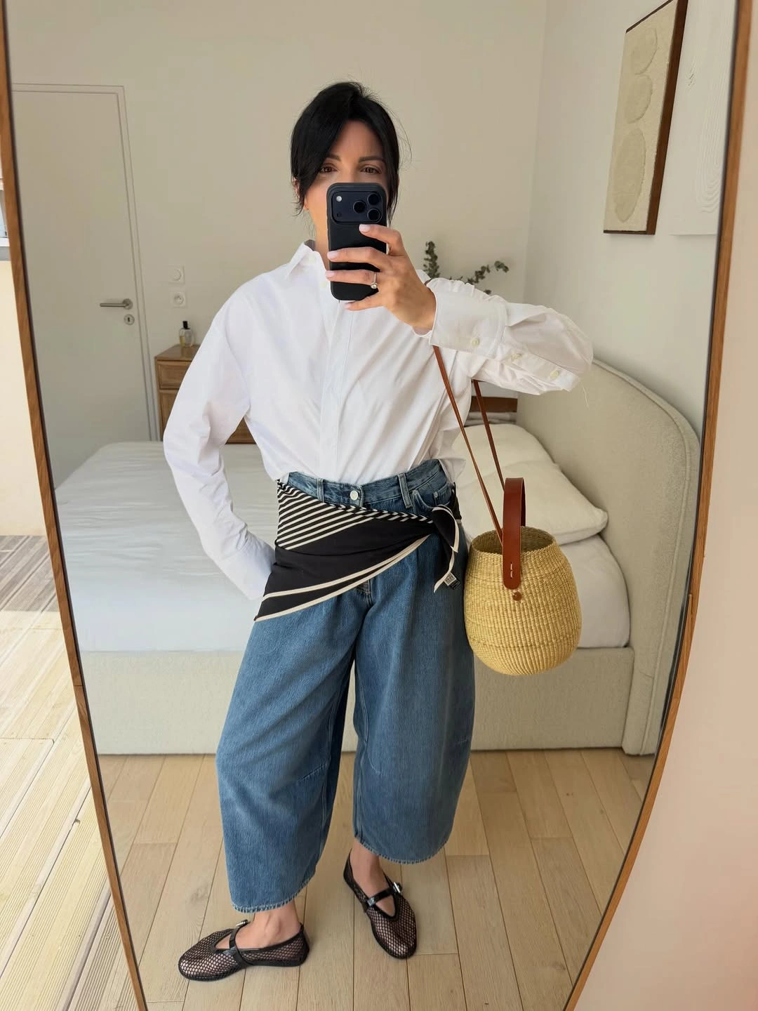 White button-down shirt with cropped blue denim trousers and striped waist detail