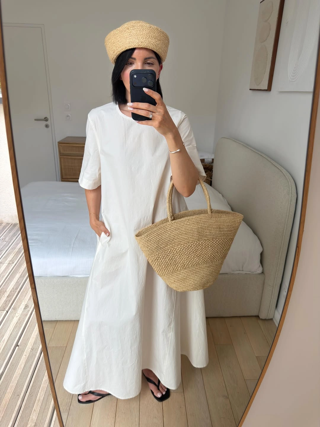 Loose white maxi dress with woven hat, basket tote, and black sandals