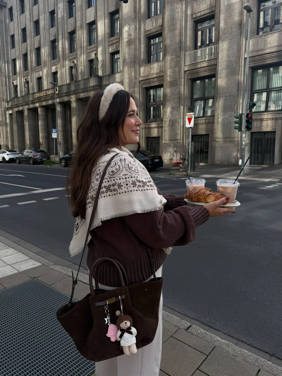 Burgundy knit with patterned cream shawl headband and decorated brown handbag