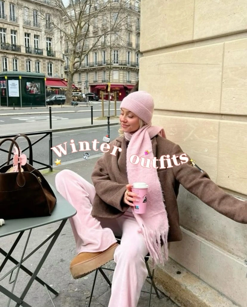 Pink beanie, scarf, and pants with brown jacket and tan shoes