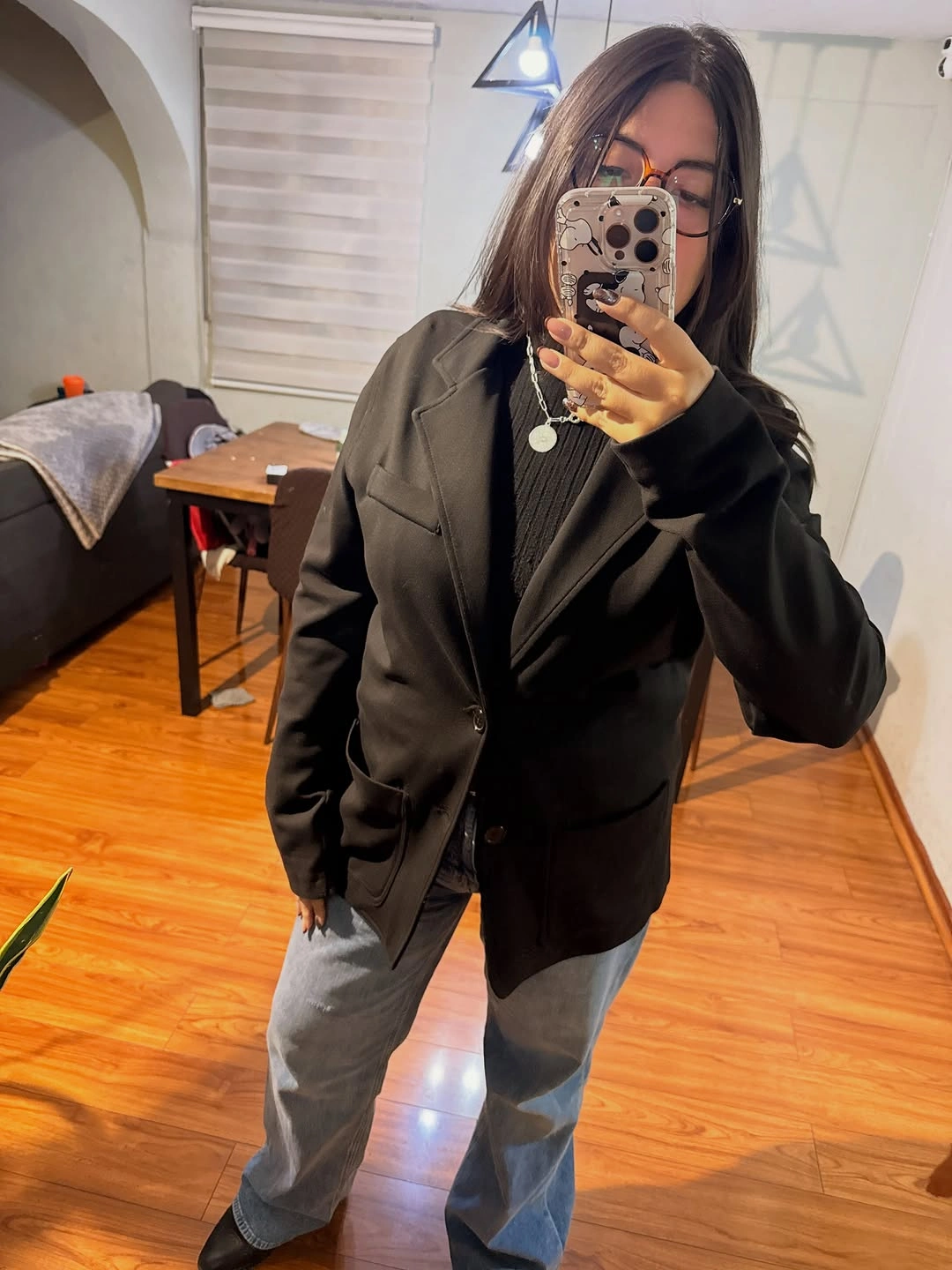 Oversized black blazer dark ribbed top loose blue jeans and glasses