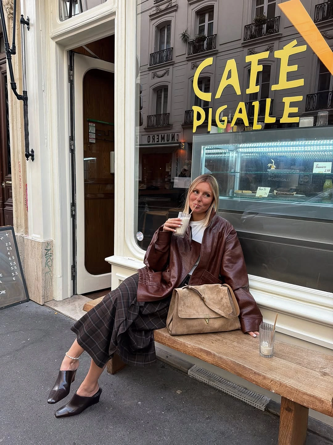 Oversized brown leather-look jacket dark plaid midi skirt and tan handbag